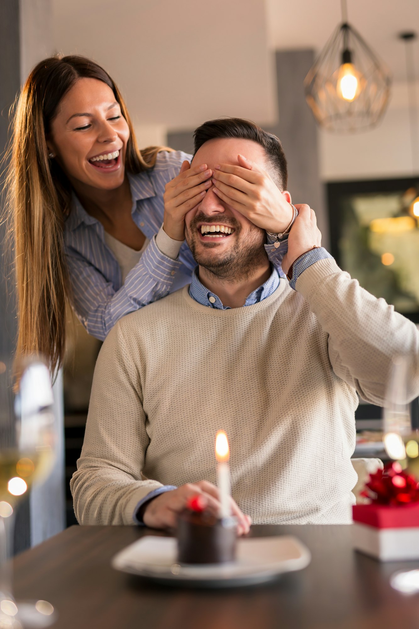 Couple celebrating birthday in restaurant